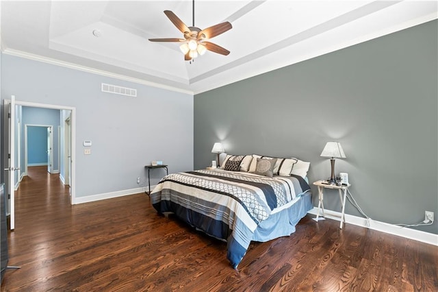 31134 W 161st St, Excelsior Springs, MO 64024 - bedroom featuring a tray ceiling, wood finished floors, ornamental molding, and a ceiling fan