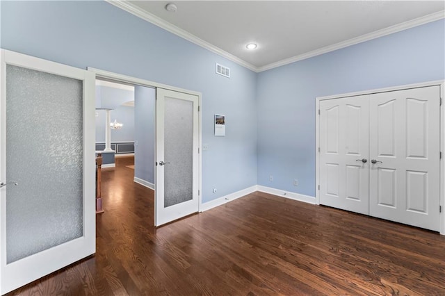 31134 W 161st St, Excelsior Springs, MO 64024 - unfurnished bedroom featuring crown molding, dark wood-style flooring, french doors, and recessed lighting