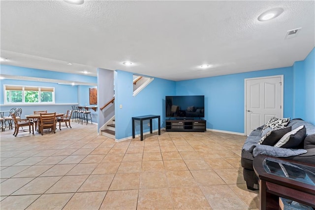 31134 W 161st St, Excelsior Springs, MO 64024 - living room with a textured ceiling, stairs, light tile patterned floors, and recessed lighting