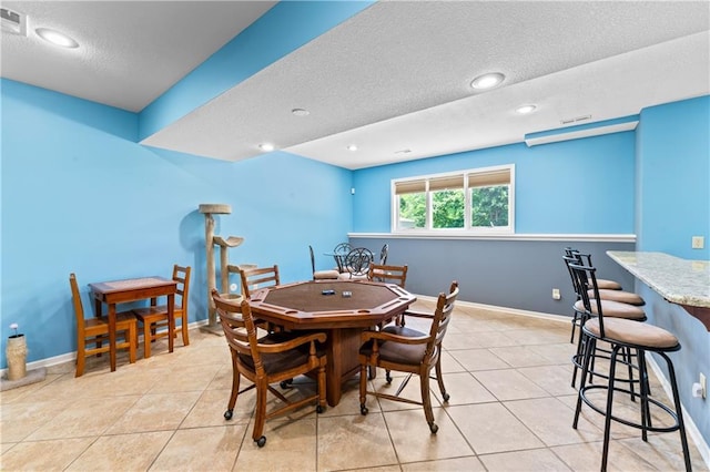 31134 W 161st St, Excelsior Springs, MO 64024 - dining area featuring a textured ceiling, light tile patterned flooring, and recessed lighting