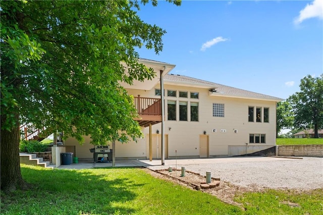 31134 W 161st St, Excelsior Springs, MO 64024 - rear view of house featuring a patio area, a yard, and a wooden deck