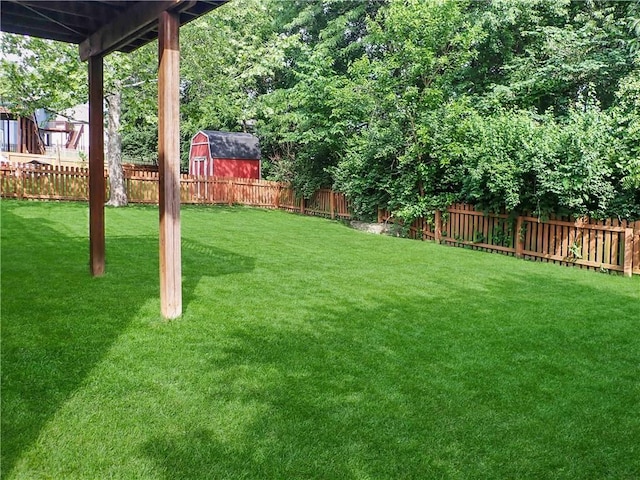 4301 NE 84th Ter, Kansas City, MO 64156 - fenced backyard with a storage shed
