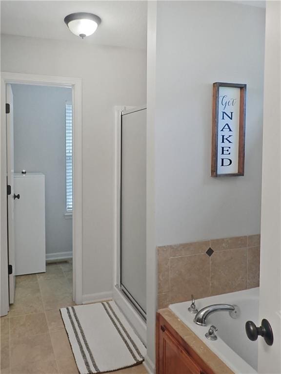 4301 NE 84th Ter, Kansas City, MO 64156 - bathroom featuring a garden tub and a shower stall