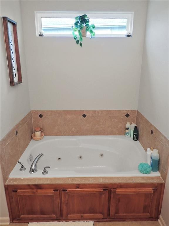 4301 NE 84th Ter, Kansas City, MO 64156 - bathroom featuring a whirlpool tub and plenty of natural light