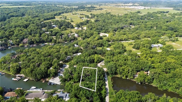 321 W Sugarlake Dr, Mound City, KS 66056 - aerial view of property and surrounding area with property boundaries highlighted and a nearby body of water
