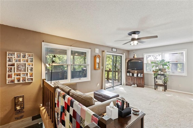321 W Sugarlake Dr, Mound City, KS 66056 - carpeted living area with ceiling fan and a textured ceiling