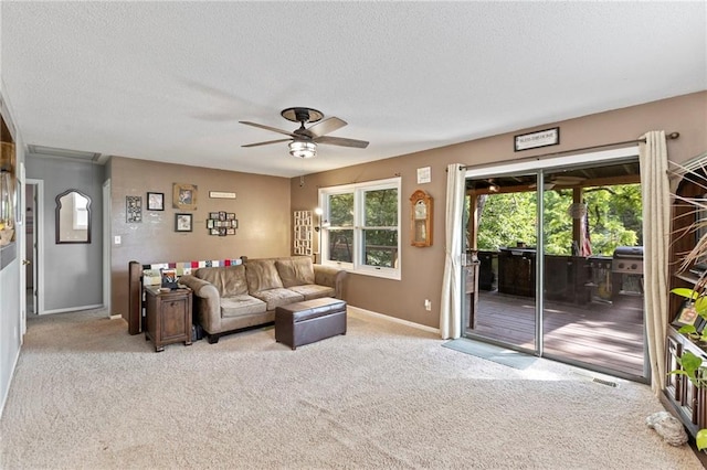 321 W Sugarlake Dr, Mound City, KS 66056 - living room with a ceiling fan, carpet, and a textured ceiling