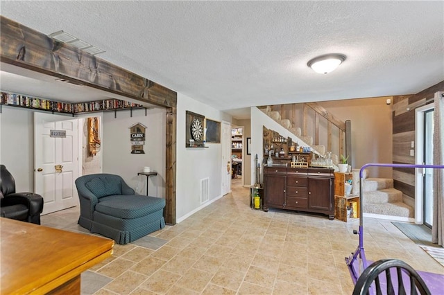 321 W Sugarlake Dr, Mound City, KS 66056 - interior space with stairs and a textured ceiling