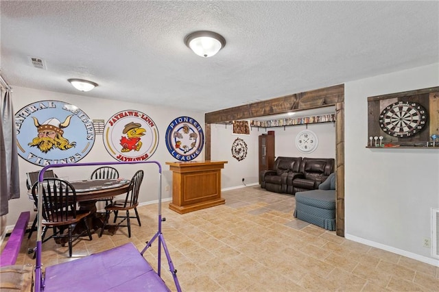 321 W Sugarlake Dr, Mound City, KS 66056 - dining space featuring a textured ceiling and baseboards