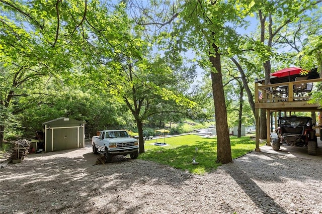 321 W Sugarlake Dr, Mound City, KS 66056 - view of green lawn with a storage unit and driveway