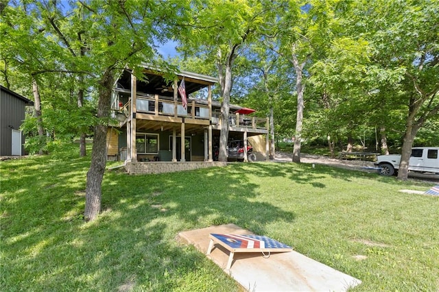 321 W Sugarlake Dr, Mound City, KS 66056 - rear view of house with a yard and a wooden deck