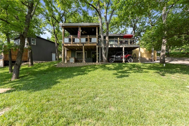 321 W Sugarlake Dr, Mound City, KS 66056 - back of house with a yard and a deck