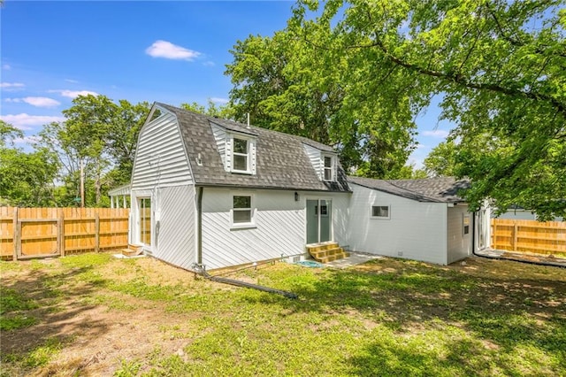 8801 E 49th St, Kansas City, MO 64129 - back of house featuring entry steps, a shingled roof, and a gambrel roof