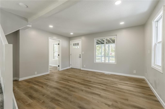 8801 E 49th St, Kansas City, MO 64129 - entryway with plenty of natural light, wood finished floors, and recessed lighting