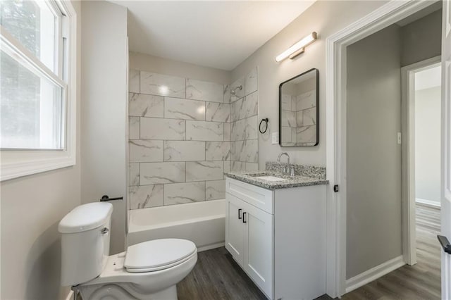 8801 E 49th St, Kansas City, MO 64129 - full bathroom featuring vanity, wood finished floors, and plenty of natural light
