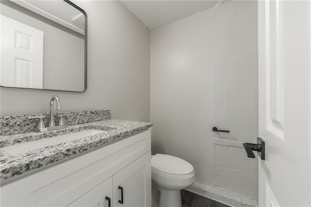 8801 E 49th St, Kansas City, MO 64129 - bathroom with vanity and wood finished floors