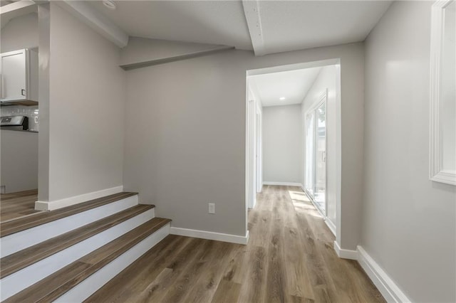 8801 E 49th St, Kansas City, MO 64129 - hall with light wood-style flooring and stairs