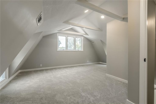 8801 E 49th St, Kansas City, MO 64129 - additional living space with carpet floors, vaulted ceiling, and recessed lighting