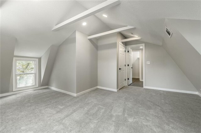 8801 E 49th St, Kansas City, MO 64129 - additional living space featuring lofted ceiling, carpet floors, and recessed lighting