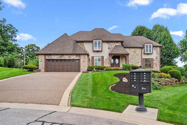 4328 W 110th St, Leawood, KS 66211 - french provincial home with stone siding, a front lawn, and asphalt driveway