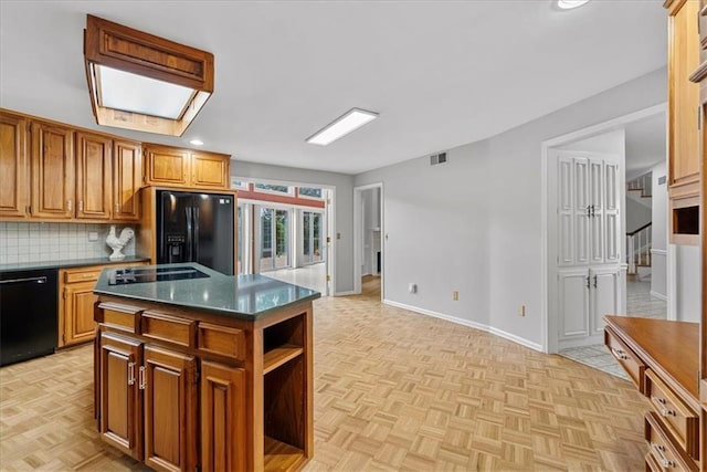 4328 W 110th St, Leawood, KS 66211 - kitchen featuring black appliances, dark countertops, decorative backsplash, a center island, and recessed lighting