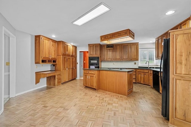 4328 W 110th St, Leawood, KS 66211 - kitchen with dark countertops, brown cabinetry, tasteful backsplash, recessed lighting, and a kitchen island