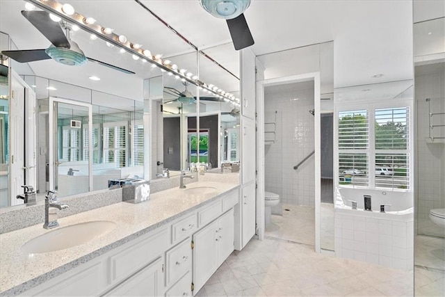 4328 W 110th St, Leawood, KS 66211 - bathroom with a ceiling fan, double vanity, and marble finish flooring