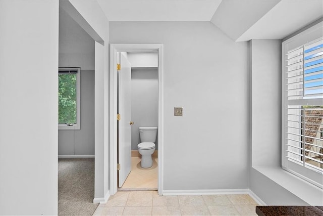 4328 W 110th St, Leawood, KS 66211 - bathroom featuring toilet and vaulted ceiling