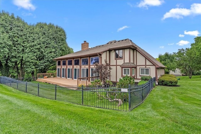 4328 W 110th St, Leawood, KS 66211 - back of house featuring a chimney, a deck, and stucco siding
