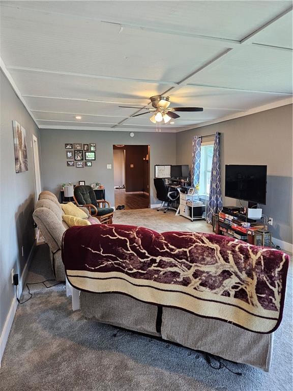 245 S 250th St, Pittsburg, KS 66762 - living area with an office area, a ceiling fan, and carpet flooring