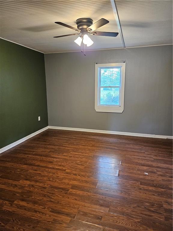 245 S 250th St, Pittsburg, KS 66762 - empty room featuring a ceiling fan and wood finished floors