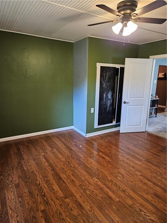 245 S 250th St, Pittsburg, KS 66762 - spare room with ceiling fan and wood finished floors