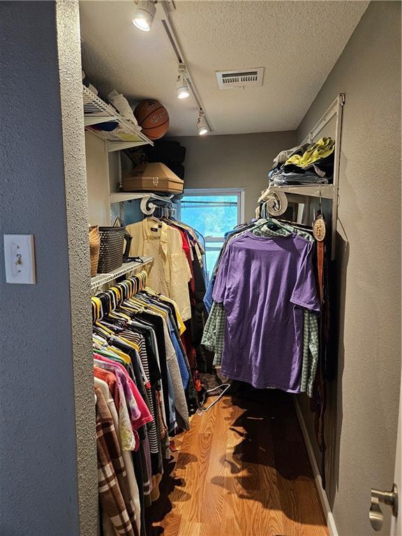 245 S 250th St, Pittsburg, KS 66762 - spacious closet featuring wood finished floors
