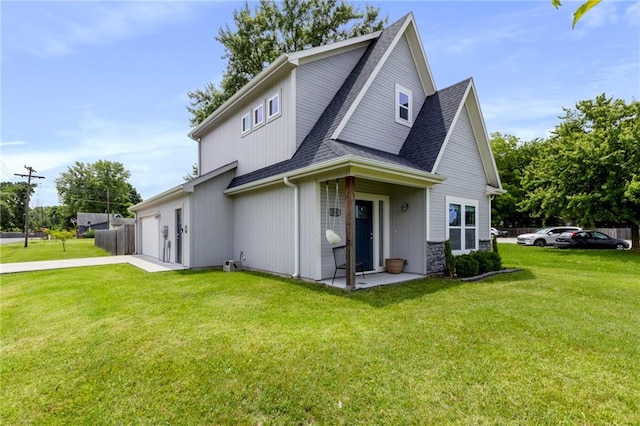 201 SW 12th St, Oak Grove, MO 64075 - view of front of home featuring roof with shingles, a front lawn, concrete driveway, and a garage