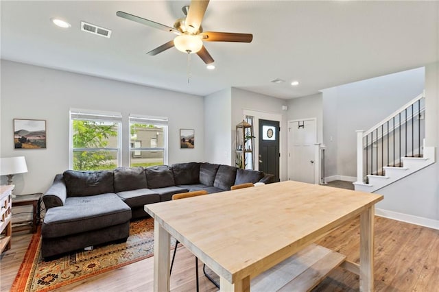 201 SW 12th St, Oak Grove, MO 64075 - living room with light wood-style floors, a ceiling fan, stairs, and recessed lighting