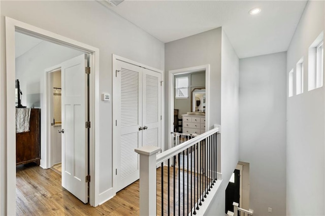 201 SW 12th St, Oak Grove, MO 64075 - corridor with an upstairs landing, plenty of natural light, light wood-type flooring, and recessed lighting