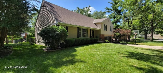 8738 Horton St, Overland Park, KS 66207 - view of front facade featuring a garage, a shingled roof, and concrete driveway