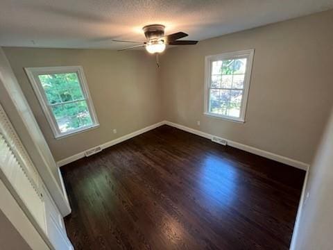 8738 Horton St, Overland Park, KS 66207 - empty room featuring dark wood-type flooring and a ceiling fan
