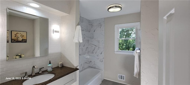 8738 Horton St, Overland Park, KS 66207 - full bathroom with vanity, backsplash, and shower / bathtub combination
