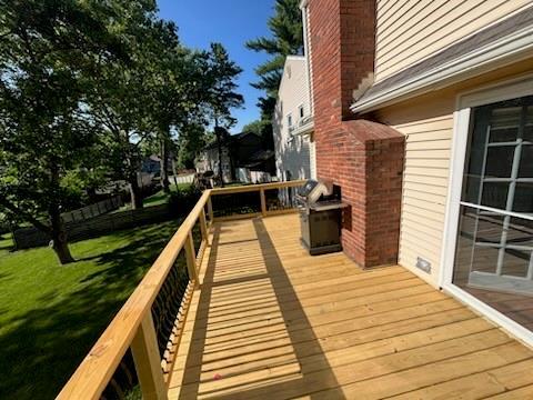 8738 Horton St, Overland Park, KS 66207 - wooden terrace with a yard