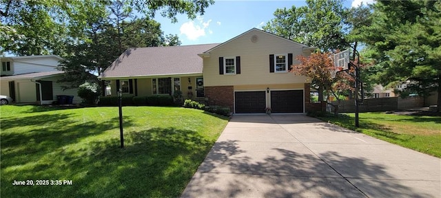 8738 Horton St, Overland Park, KS 66207 - split level home with concrete driveway, a garage, and brick siding