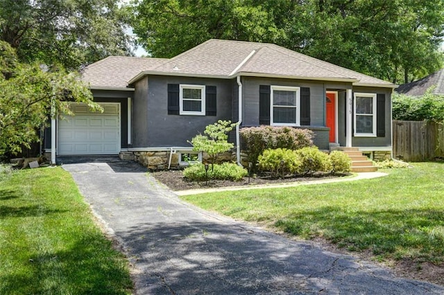 5915 Fontana St, Fairway, KS 66205 - view of front facade featuring a garage, asphalt driveway, a shingled roof, and entry steps
