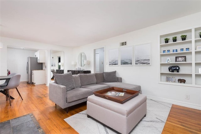 5915 Fontana St, Fairway, KS 66205 - living area with light wood-type flooring and built in features
