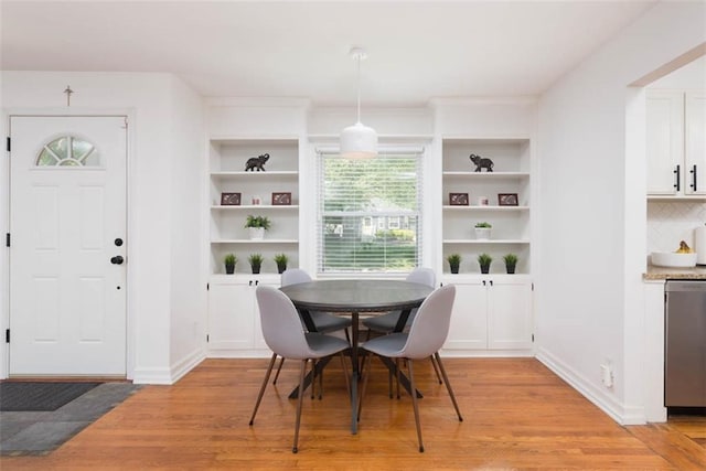 5915 Fontana St, Fairway, KS 66205 - dining space featuring light wood-style flooring and built in shelves