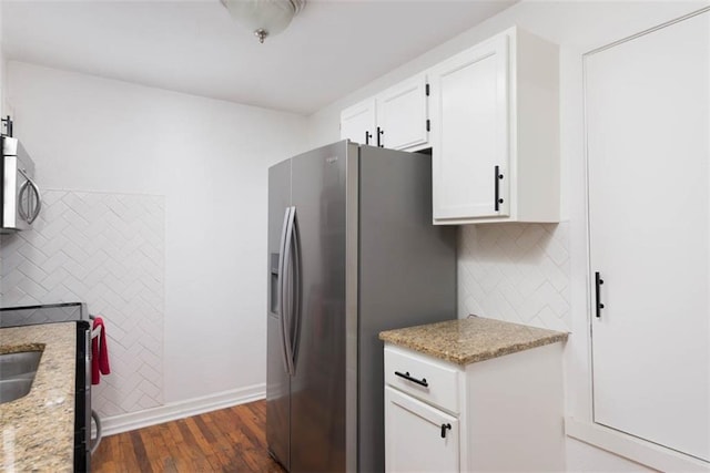 5915 Fontana St, Fairway, KS 66205 - kitchen with stainless steel appliances, dark wood finished floors, white cabinetry, backsplash, and light stone counters