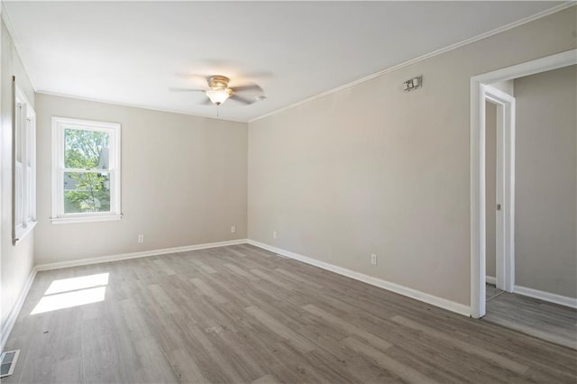 15309 E Mayes Rd, Independence, MO 64050 - empty room with a ceiling fan, wood finished floors, and crown molding