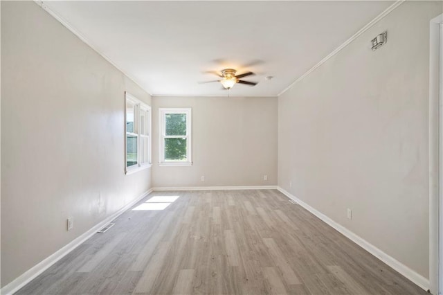 15309 E Mayes Rd, Independence, MO 64050 - unfurnished room featuring ornamental molding, light wood-style floors, and a ceiling fan