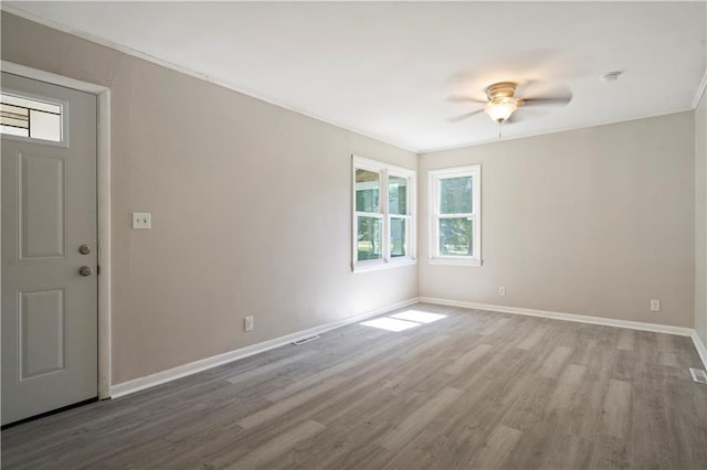 15309 E Mayes Rd, Independence, MO 64050 - unfurnished room featuring wood finished floors, a ceiling fan, and a smoke detector