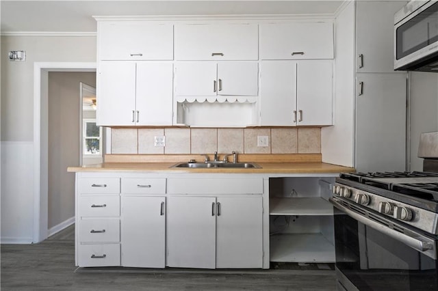 15309 E Mayes Rd, Independence, MO 64050 - kitchen featuring appliances with stainless steel finishes, open shelves, wood finished floors, tasteful backsplash, and ornamental molding