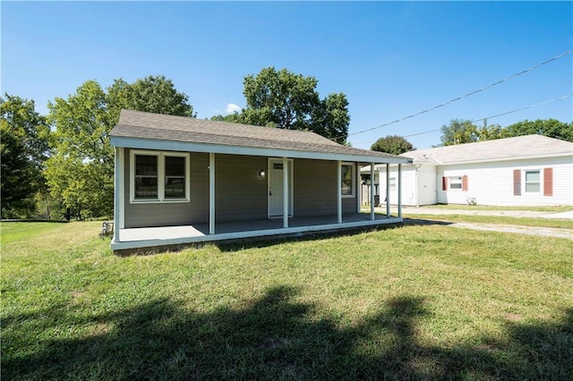 15309 E Mayes Rd, Independence, MO 64050 - back of property with a lawn and a porch